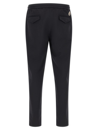 Брюки MONCLER Logo patch joggers (L20912A0003389ALO999) #