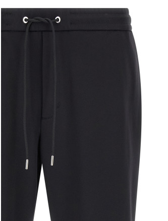 Брюки MONCLER Logo patch joggers (L20912A0003389ALO999) #