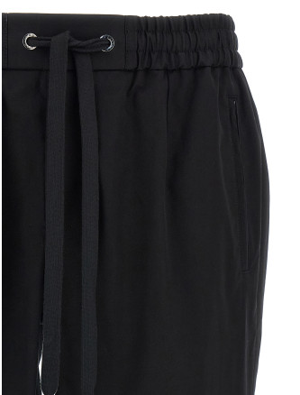 Брюки DOLCE & GABBANA Logo plaque pants (GVZAETGK302N0000) #